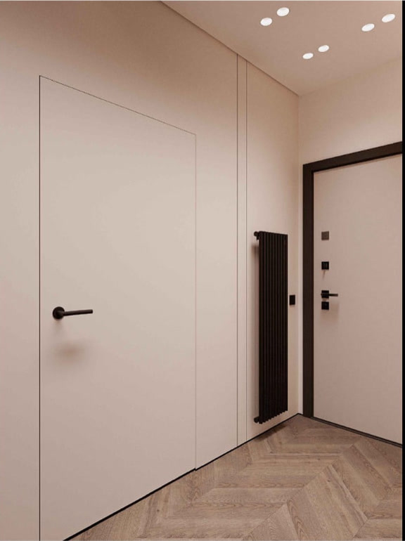 Hallway with concealed doors and herringbone parquet