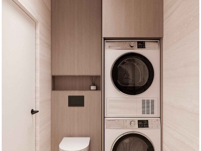 Utility room with a washing machine and tumble dryer