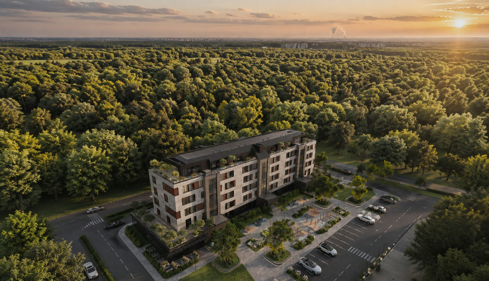 Aerial view: the complex on the forest edge at sunset, surrounded by woodland