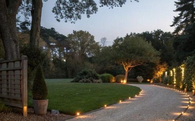 Lit evening walkway beside the residential buildings